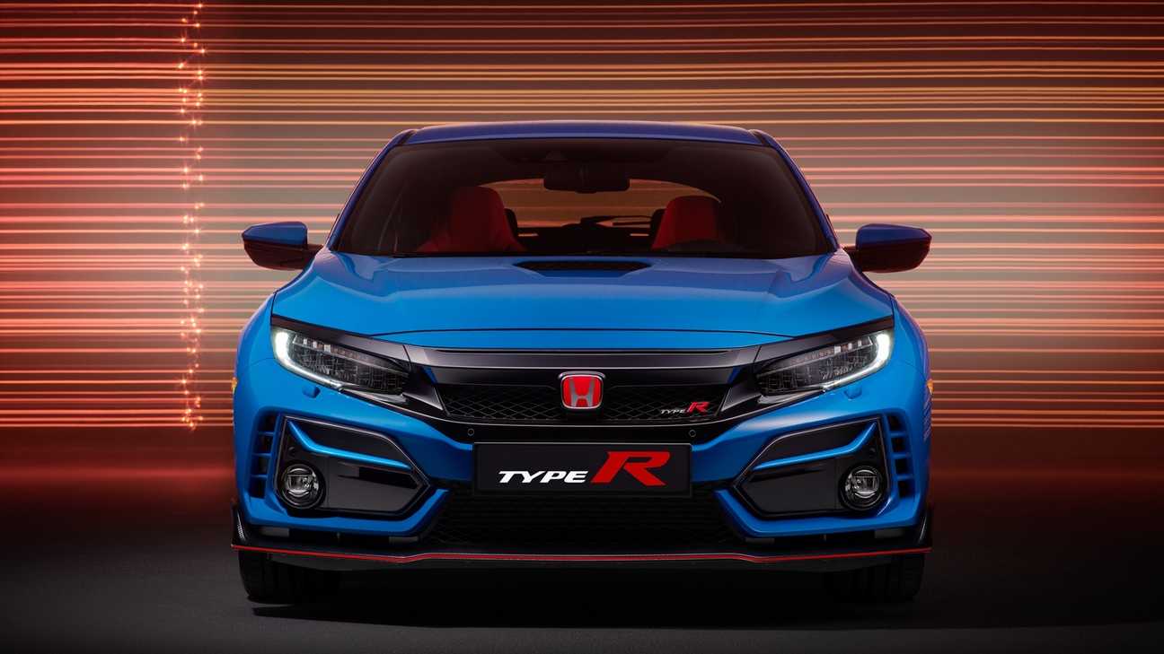 Front-facing view of Civic Type R GT displaying side grilles in street location.