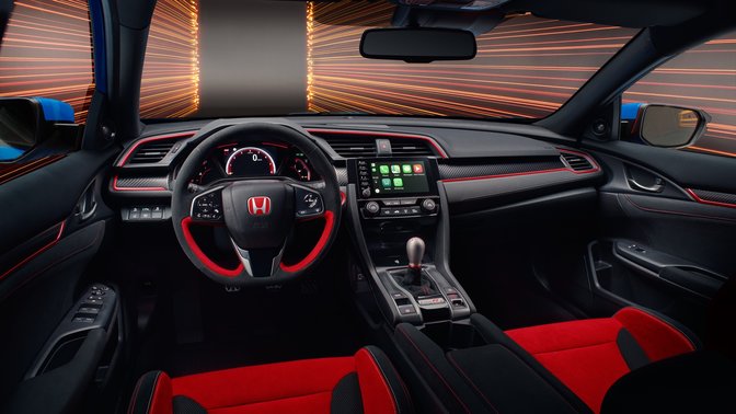 Side facing view of red interior car seats in Honda Civic Type R GT car.