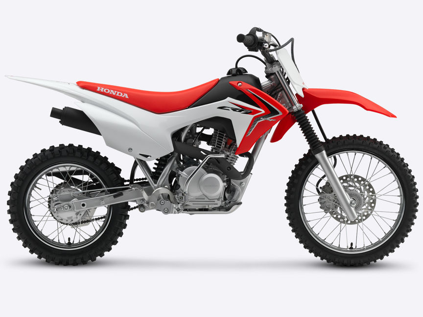 Seitenansicht einer roten CRF125F, nach rechts weisend.