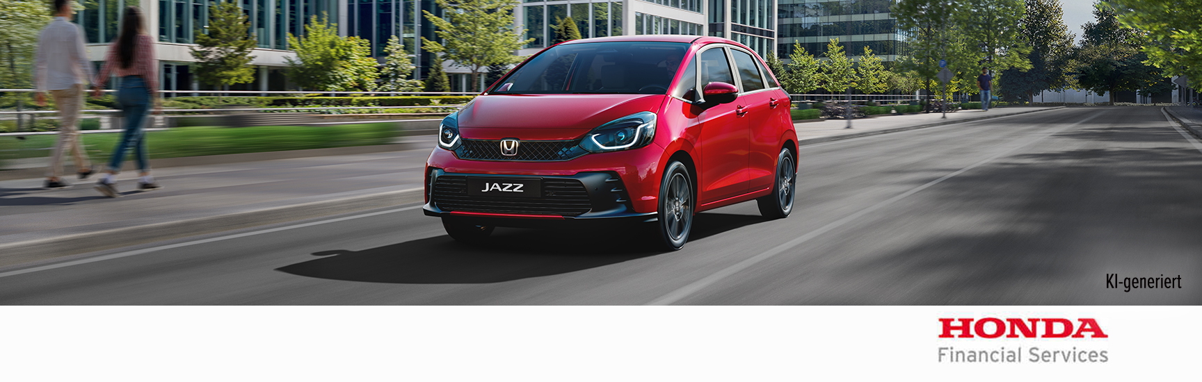 Ein Honda Jazz fährt bei Nacht durch die Stadt.